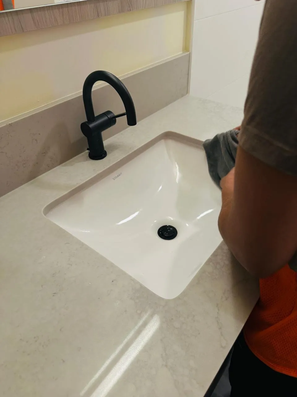 Sanitized commercial washroom sink after cleaning